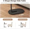 Demonstration of a C-shaped side table's space-saving placement. Náhľad obrázku produktu