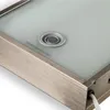 Close-up view of a shelf with a frosted glass top and a metal frame. Produktbild-Vorschau