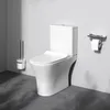 A white toilet with a toilet brush holder and a toilet paper holder with a phone stand. Produktbild-Vorschau