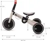 A product shot of a children's tricycle with dimensions indicated by lines and text. Produktbild-Vorschau
