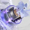 Close-up, cutaway view of a water filter mechanism with glowing purple light and water effects. Produktbild-Vorschau