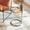 A modern living room setting with a chair and a side table. Anteprima dell’immagine prodotto