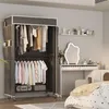 A portable wardrobe and dressing table setup in a bedroom. Voir les images du produit