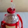 Close-up of a fermentation vessel with a red cap and airlock, containing grain and liquid. Produktbild-Vorschau