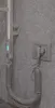A close-up of a chrome electric towel rack plugged into a wall socket. Náhľad obrázku produktu