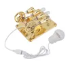 A gold-colored Stirling engine model with a white LED light connected by a white cable. Produktbild-Vorschau
