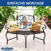 A metal garden bench with decorative butterfly backrest and cushions, set outdoors with plants and flowers. Anteprima dell’immagine prodotto