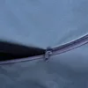 A close-up view of a zipper on a gray fabric surface. Produktbild-Vorschau