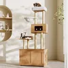 A cat tree with multiple levels and a storage cabinet is shown in a well-lit room with natural light and shadows. Anteprima dell’immagine prodotto