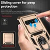 A hand is holding a gold smartphone case with a sliding camera cover and a ring holder. The case has a textured pattern and protective features are highlighted with text and graphics. Produktbild-Vorschau