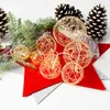 A collection of Christmas-themed decorative items including pine cones, pine branches, and a string of LED lights with spherical ornaments. Náhľad obrázku produktu