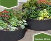 Zwei runde dunkelgraue Stoff-Pflanzer gefüllt mit verschiedenen grünen Pflanzen und bunten Blumen Náhľad obrázku produktu