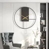 A modern living room with a minimalist wall clock and a plush armchair. Produktbild-Vorschau