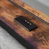 A close-up view of a wooden surface with a black USB charging port. Anteprima dell’immagine prodotto
