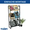 A metal shelving unit displaying various items like apples, bottles, and crates of drinks, with a plant in the foreground. Produktbild-Vorschau