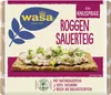 The image shows the packaging of Wasa Roggen Sauerteig crispbread, with a serving suggestion of the crispbread topped with a spread and garnishes. Produktbild-Vorschau
