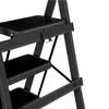 A close-up view of a black step stool. Voir les images du produit