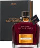 A bottle of prune brandy and its gift box are displayed against a white background. Produktbild-Vorschau