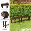 A wooden garden bench is shown outdoors on a grassy lawn, with a hedge and wooden fence in the background. Inset circles highlight construction details of the bench. Náhľad obrázku produktu