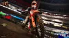 A motocross rider in a stadium during a race. Produktbild-Vorschau