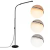 A floor lamp with a flexible neck and three circular insets showing different color temperatures of the light. Produktbild-Vorschau