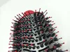A close-up view of the bristles and barrel of a round hairbrush. Voir les images du produit