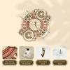 A 3D wooden puzzle clock with multiple gears and decorative elements, displayed against a light beige background. Below the clock are four smaller images showcasing details of the product and its accessories. Voir les images du produit