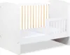 A white baby crib with wooden slats. Produktbild-Vorschau