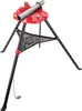 A red and black pipe vise stand with a metal pipe clamped in it, isolated on a white background. Náhled obrázku produktu
