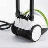 A close-up shot of a white and green steam cleaner with black accents and wheels, resting on a white surface. Various cleaning attachments are stored in a compartment on top of the device. Anteprima dell’immagine prodotto