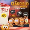 A marketing image for The Garfield Movie featuring plush toys and promotional text. Podgląd zdjęcia produktu