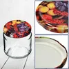 A collage of images showing a glass jar with a lid decorated with a fruit pattern, a close-up of the lid, and a close-up of the jar's rim. Podgląd zdjęcia produktu