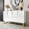 A white high-gloss sideboard with gold accents is displayed in a modern interior setting. Produktbild-Vorschau