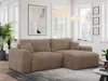 A modern living room with a large cord sofa.