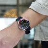 A person wearing a watch on their wrist. Produktbild-Vorschau