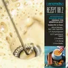 A close-up of a frothy beverage being mixed with a whisk, next to a recipe for "Golden Milk" and an image of the finished drink. Produktbild-Vorschau