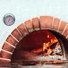 A thermometer is attached to the side of a brick pizza oven with a fire burning inside. Produktbild-Vorschau