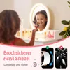A young girl is applying makeup in front of a lighted vanity mirror. The image also includes marketing text and diagrams. Náhled obrázku produktu