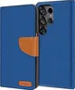 A blue flip case for a smartphone, with a brown leather strap closure and a small brown logo on the bottom left. Anteprima dell’immagine prodotto