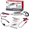 A product shot of a car battery charger and its accessories, along with its packaging and manual. Produktbild-Vorschau