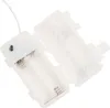 A white plastic battery holder with two compartments for AA batteries, shown open with a white wire extending from the top. Voir les images du produit