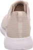 The back view of a beige Skechers sneaker. Voir les images du produit