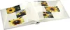 An open photo album with pages displaying pictures of sunflowers. Anteprima dell’immagine prodotto