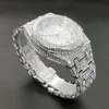 A close-up, angled view of a diamond-encrusted watch on a dark background. Produktbild-Vorschau