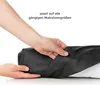 Hands are shown folding a black fabric product, possibly a fitted sheet or mattress protector, against a white background. Náhled obrázku produktu