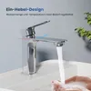 A chrome faucet in a bathroom sink with water running and hands being washed. Náhled obrázku produktu