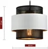 A pendant light fixture with a white fabric shade and black perforated metal accents. Podgląd zdjęcia produktu