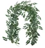 A garland of artificial eucalyptus leaves and round leaves against a white background. Anteprima dell’immagine prodotto