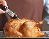 A person is using a digital thermometer to check the internal temperature of a roasted chicken. Podgląd zdjęcia produktu