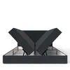 A dark gray upholstered bed frame with the mattress sections lifted to reveal the storage compartments underneath. Voir les images du produit